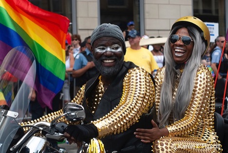 Happy motorcylists wearing gold costumes